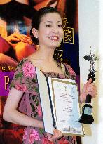 Rie Miyazawa shows off best actress prize